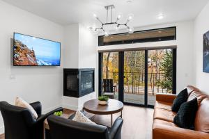 a living room with a couch and chairs at Apres Shores #C13 in Silverthorne