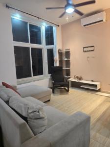 a living room with a couch and a chair at Casa Vidalta in San Sebastián