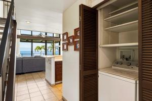 a kitchen and living room with a view of the ocean at Spacious 2BR Oceanfront Loft - Unit C17 condo in Lahaina +34 photos