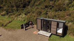 an overhead view of a tiny house on a hill at Te Paki Dam View X by Tiny Away in Sanson