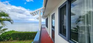 a house with a view of the ocean at Toreaiva 91 Beachfront Studios in Arorangi