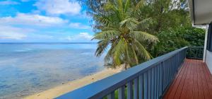 a balcony with a view of the beach at Toreaiva 91 Beachfront Studios in Arorangi