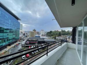 a balcony with a view of a city at Puerto Montt centro 2 diagonal Germania in Puerto Montt