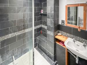 a bathroom with a sink and a shower at Sunnyside in Yoxford