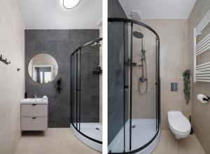a bathroom with a shower and a toilet and a sink at Apartamenty Racławicka Mszczonów in Mszczonów