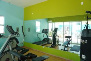 a gym with two treadmills and two exercise bikes at Ocean View, Amazing Sunsets, AC, Pool in Tijuana