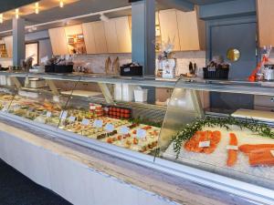 a buffet line with many different types of food at Comfortable Apartment Near Stenungsund in Munkedal +19 photos