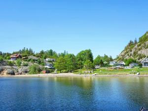 a large body of water with houses on a hill at Comfortable Apartment Near Stenungsund in Munkedal