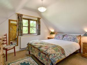 a bedroom with a bed and a window at Annexe- Ukc4917 in Timberscombe