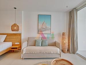 a bedroom with a couch and a bed and a bridge at Suite studio à Anse Marcel - 2 pers. - FR-1-734-87 in Marigot