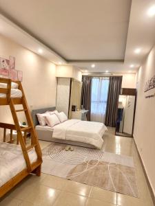 a bedroom with two bunk beds and a window at Hanoi Amie Duplex Homestay in Hanoi