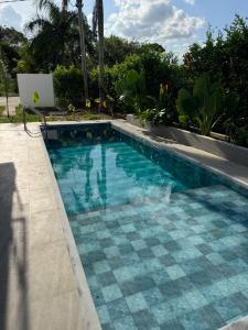a swimming pool with a laptop sitting next to it at Entrebosques in Granada
