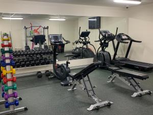 a gym with several exercise equipment in a room at Alexandra Hills Hotel in Cleveland
