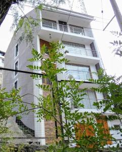 a white building with a staircase in front of it at MAKEYA Home-Hotel in Churín