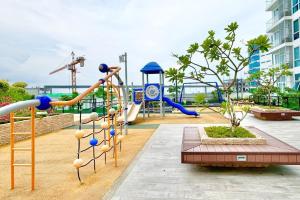 a park with a playground with a slide at Mactan Newtown Studio Type with Balcony in Punta Engaño