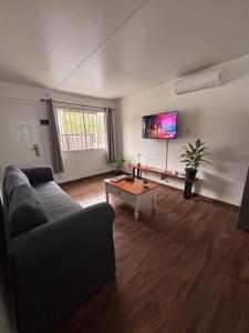 a living room with a couch and a coffee table at Complejo San Luis in San Luis