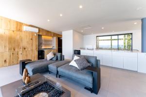a living room with a couch and a table at Villa CASK Setouchi in Mitoyo