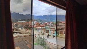 a view of a city from a window of a town at Hospedaje El Manantial in Chontabamba