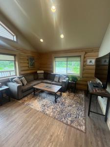 a living room with a couch and a table at Clear Creek Cabins in Seward