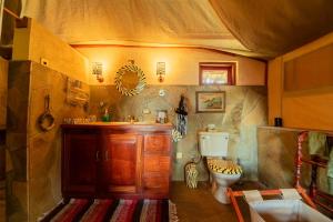 a bathroom in a tent with a toilet and a sink at Buffalo's Rest Greenpark-Naivasha in Naivasha +94 photos