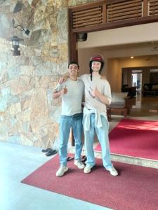 two people posing for a picture in a lobby at Sanctuary Resort in Rakwana +149 photos