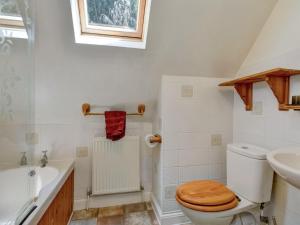a bathroom with a toilet and a sink at Annexe- Ukc4917 in Timberscombe