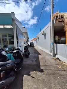 a group of motorcycles parked next to a building at Villa Luck Canggu Bali unit 7 in Canggu