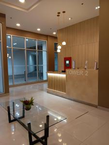 a lobby of a hotel with a reception desk at Josephine's place at Avida Aspira Tower 2 CDO in Cagayan de Oro +16 photos