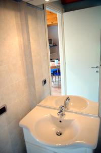 a bathroom with a sink and a mirror at Casa Angelino in Cannobio