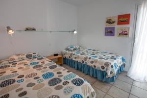 Los Cabosos 40, Pasito Blanco, Gran Canariaにあるベッド