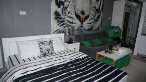 Postel nebo postele na pokoji v ubytování White Tiger in New Gudauri II