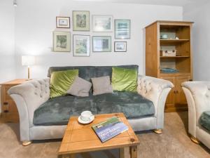 a living room with a couch and a coffee table at Denham in Glaisdale