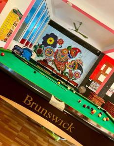 a billiard table in a store with at Vang Vieng Freedom View Hostel in Ban Khouaphan