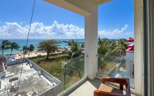 a balcony with a view of the beach at Grand Boréna Hotel Boutique in Playa del Carmen