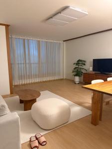 a living room with a couch and a table at juns house in Ulsan