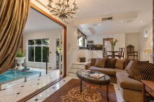 a living room with a couch and a table at The Castle on Tamborine in Mount Tamborine