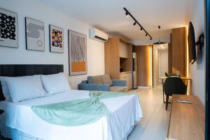 a bedroom with a bed and a living room at Skylux by Tegra in Rio de Janeiro +65 photos