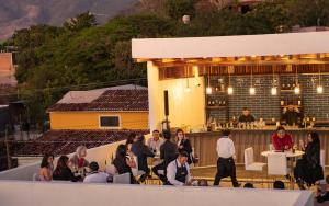 a group of people sitting on the roof of a building at Eloína Hotel Boutique in Chiapa de Corzo