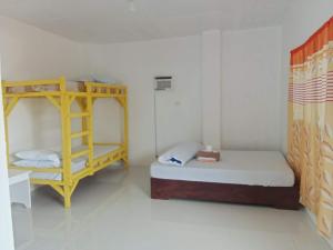 a room with two bunk beds and a ladder at Scott Camotes Beach House in San Francisco
