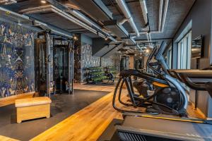 a gym with a treadmill and exercise equipment at Me and All Hotel Ulm, by Hyatt in Ulm
