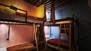 a room with three bunk beds in a hostel at La Kasbah Salam Hostel in Fez