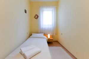 Posteľ alebo postele v izbe v ubytovaní Apartments Doda