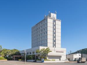 a large white building with aventh floor at Minakuchi Century Hotel in Koka