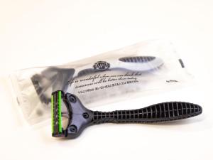a pair of scissors on top of a package at APA Hotel Okhotsk Kitami in Kitami