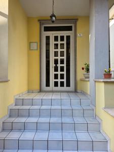 a front door of a house with stairs at Casa a Pennello Bed & Breakfast - Dove l'arte incontra l'ospitalità in San Benedetto del Tronto