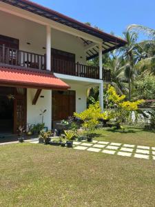 a view of the house from the yard at Lila Lodge, Villa - Bentota in Bentota