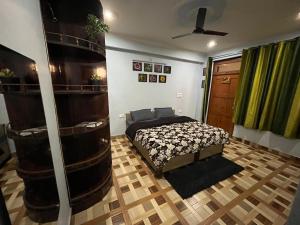 a bedroom with a bed in a room at Dostel in Bhowāli