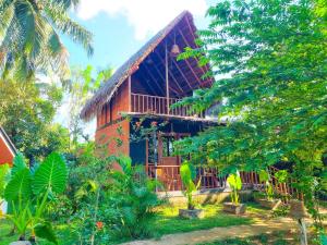 a house in the middle of a forest at Nature Rest Ashored in Sigiriya