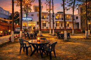a group of tables and chairs in front of a building at Park Palace in Lucknow +21 photos