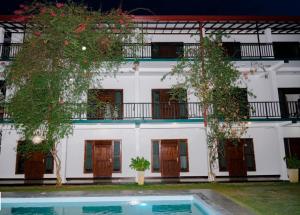 a building with a pool in front of it at BTI Leisure Hotel in Kataragama